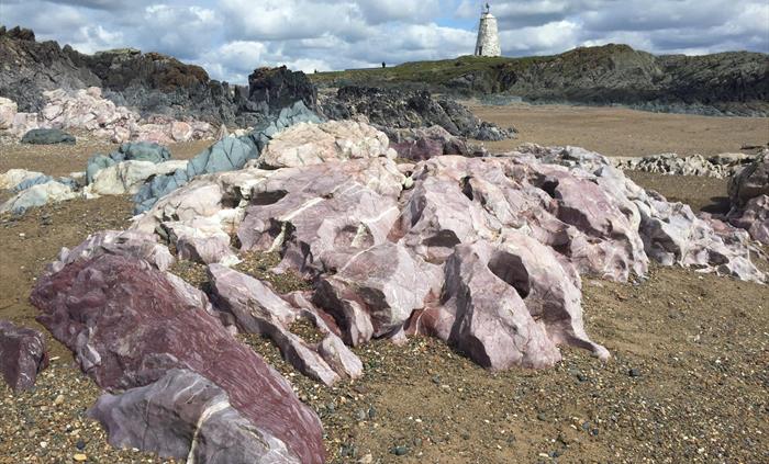 Ynys Llanddwyn, these amazingly coloured rocks are a complex mixture (a melange) of limestone, marble, pillow lava and deep sea sediments dating from